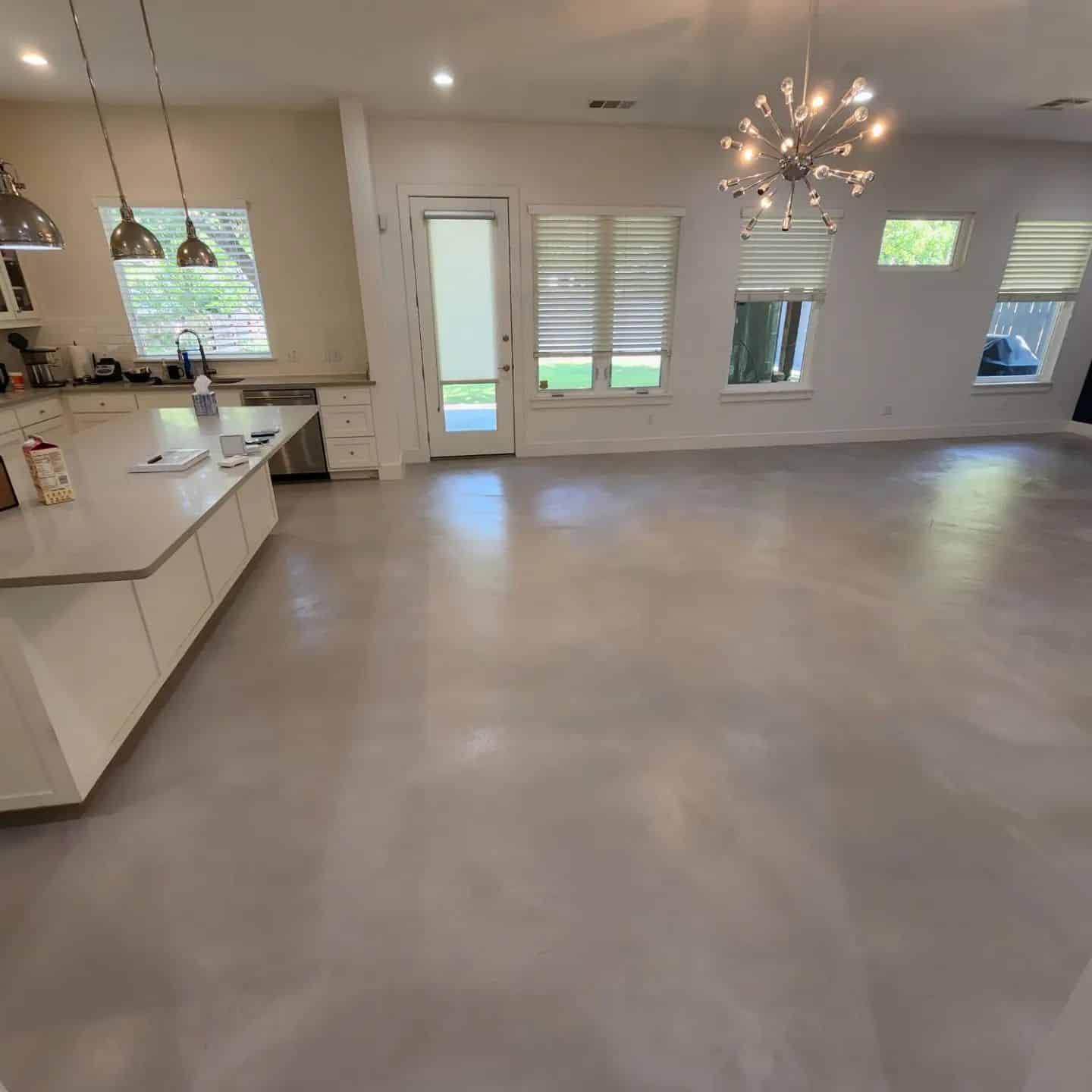 kitchen and living room in Austin with stained concrete floors