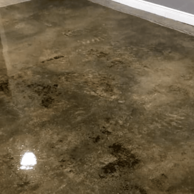 distressed concrete floor that is polished and stained
