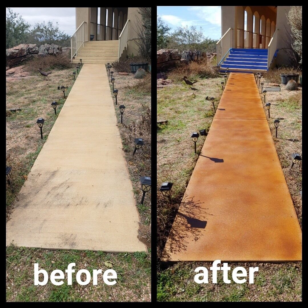 The image is a side-by-side comparison showing the transformation of a concrete walkway. On the left, the walkway appears plain and worn, with visible stains and a lack of color. On the right, the same walkway has been revitalized with a rich, warm-toned stain, enhancing its appearance with a vibrant, uniform color. The surrounding landscape and architectural elements remain the same in both images, indicating that only the walkway was refurbished. The upgrade gives the path a refreshed and more inviting look